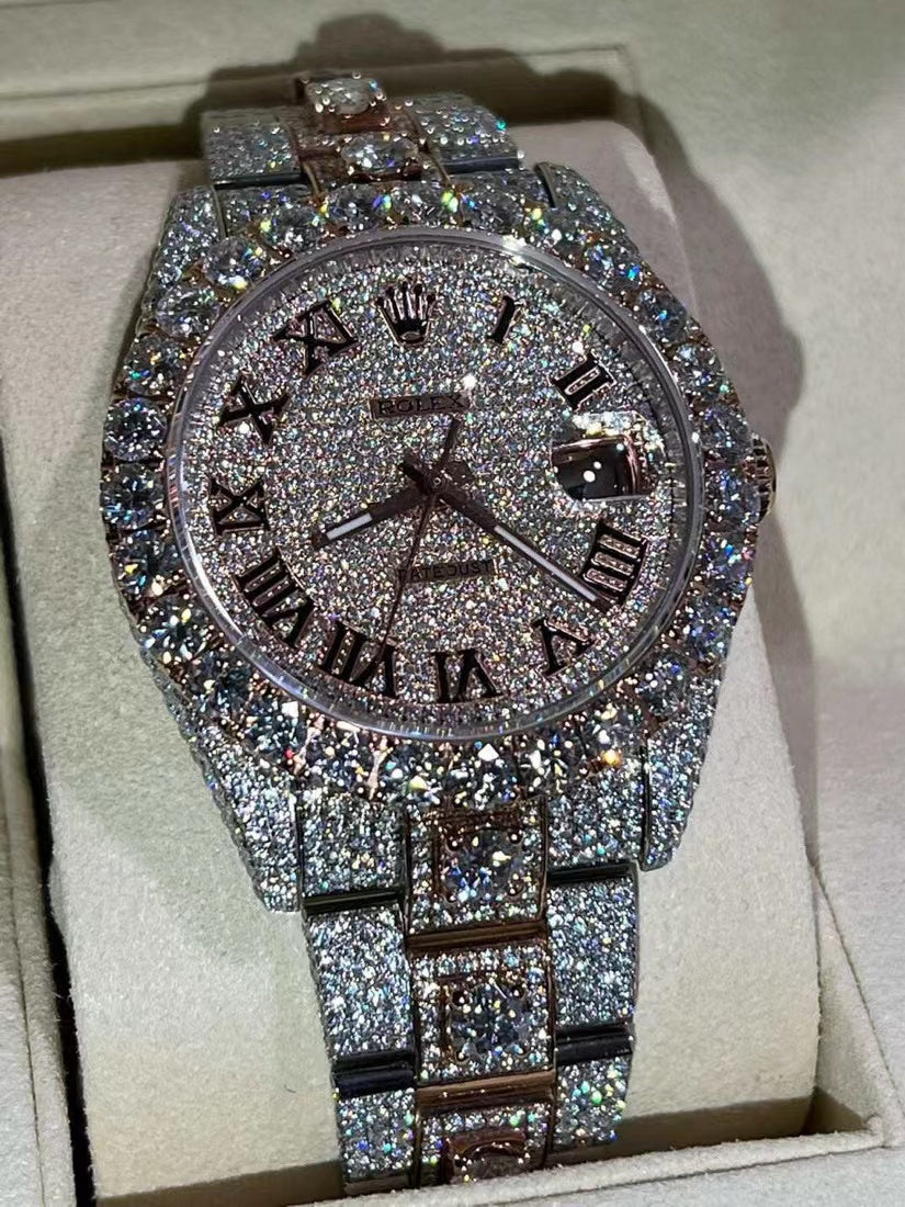 ROLEX DATEJUST ICED OUT WITH ROSE GOLD ROMAN DIAL – LARGE STONES BEZEL TWO-TONE