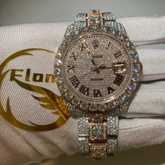 ROLEX DATEJUST ICED OUT WITH ROSE GOLD ROMAN DIAL – LARGE STONES BEZEL TWO-TONE